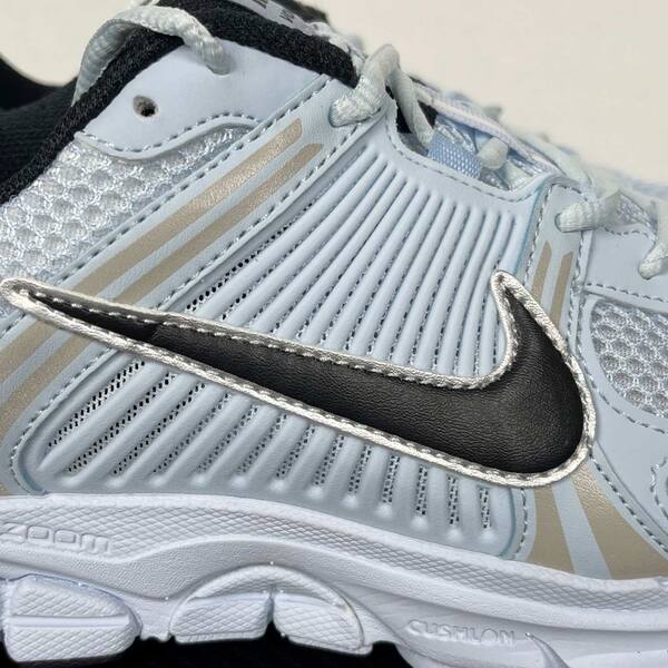 Nike Zoom Vomero 5 light blue / white / black with metallic silver accents running
