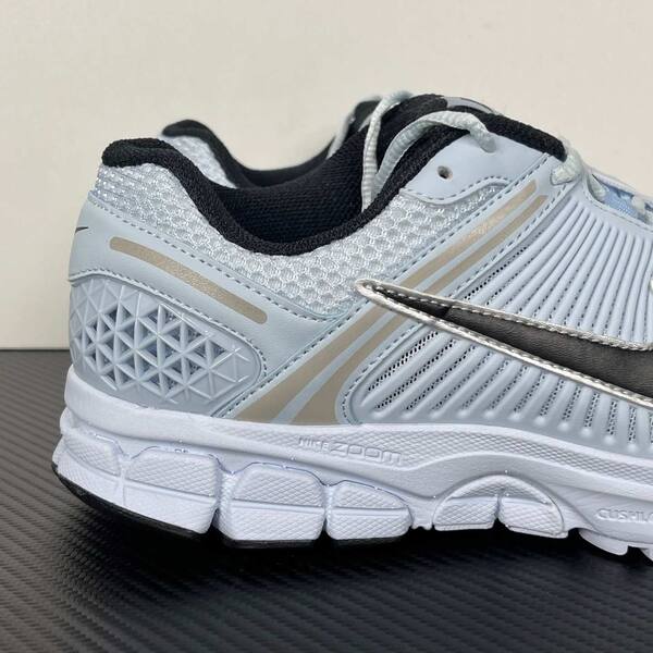 Nike Zoom Vomero 5 light blue / white / black with metallic silver accents running