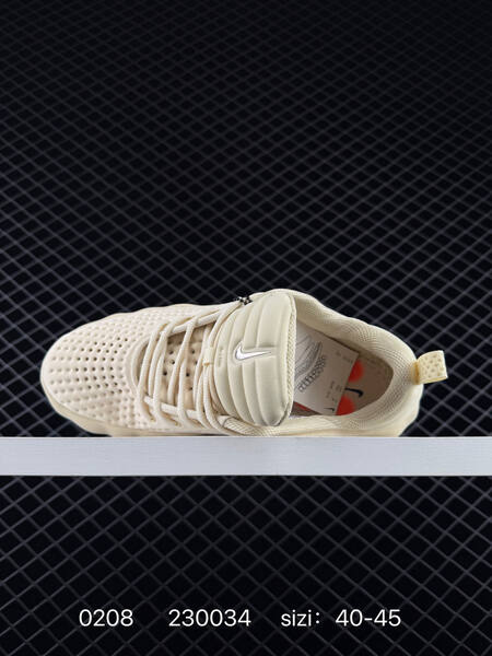 Nike Mind 002 beige cream with black swoosh and orange outsole accents 40-45 training lifestyle